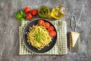 Pasta with fresh homemade pesto sauce and food ingredients